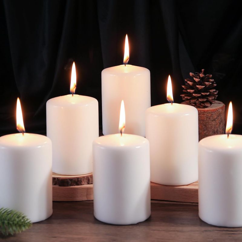Photo 1 of **USED** 12 Pcs White Pillar Candles, 2.8x4 Inches 50 Hour Long Lasting Candles, Smokeless & Dripless