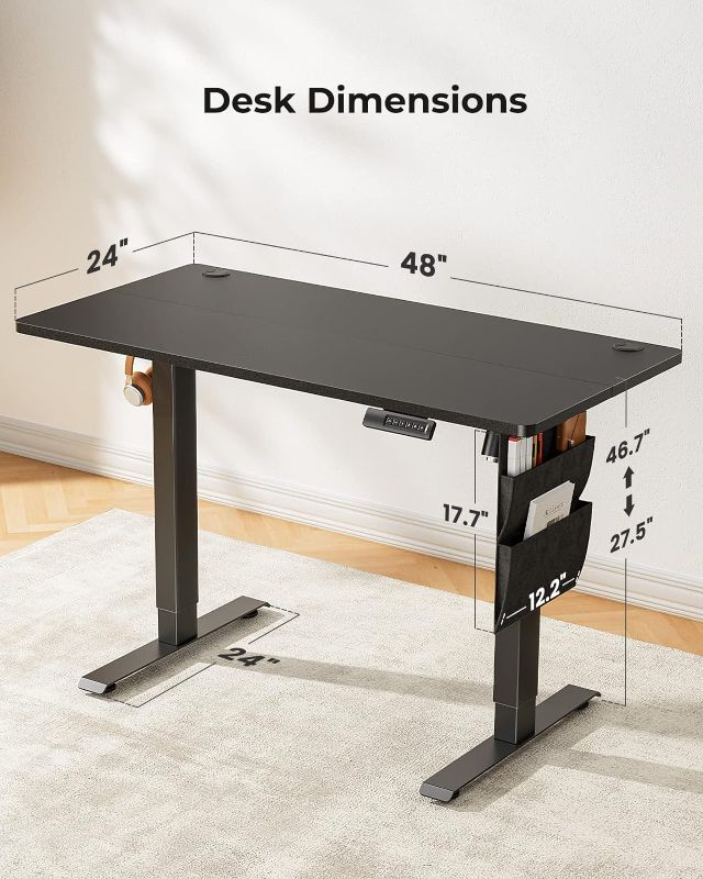 Photo 1 of Marsail Standing Desk Adjustable Height,?48x24 Inch Electric Standing Desk, Stand up Desk with Storage Bag,Headphone Hook for Computer Workstations Desk Memory Preset
