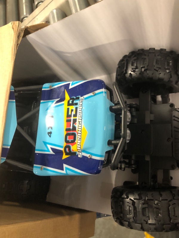 Photo 3 of DOUBLE E RC Car 1:12 Remote Control Car Monster Trucks 4WD Off Road RC Truck with Head Lights All Terrain Electric Vehicles Multicolored