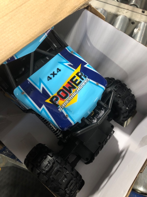 Photo 2 of DOUBLE E RC Car 1:12 Remote Control Car Monster Trucks 4WD Off Road RC Truck with Head Lights All Terrain Electric Vehicles Multicolored