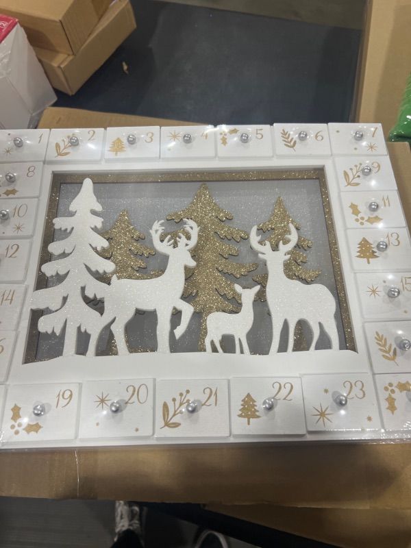 Photo 1 of Zcaukya Christmas Advent Calendar, Pre-lit LED Wooden Reindeer Christmas Advent Calendar with 24 Drawers, 24 Days Christmas Countdown Calendar Reindeer Wooden