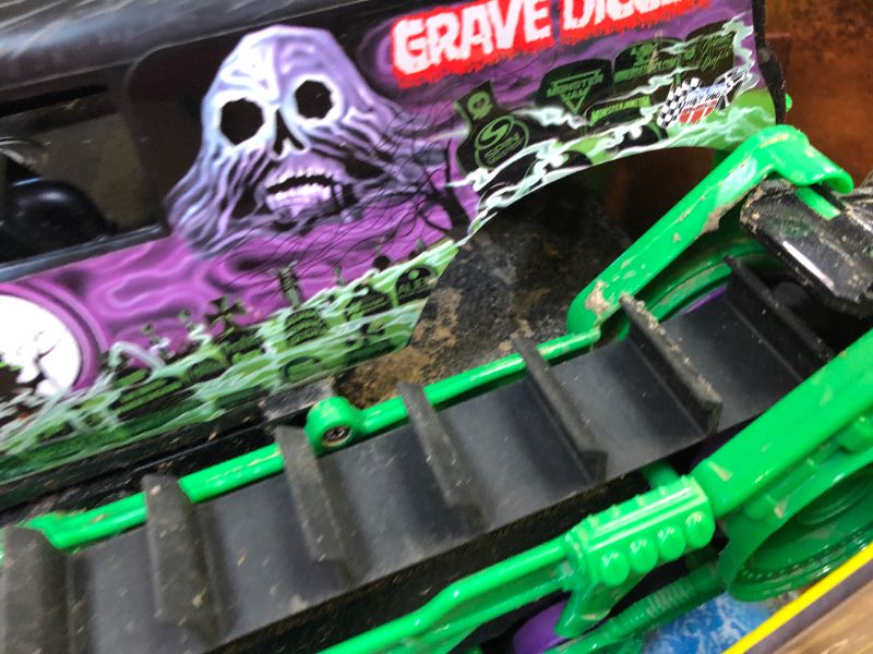 Photo 3 of Monster Jam, Official Grave Digger Trax All-Terrain Remote Control Outdoor Vehicle, 1:15 Scale, Kids Toys for Boys and Girls Ages 4 and up Grave Digger Trax (Retail Packaging)