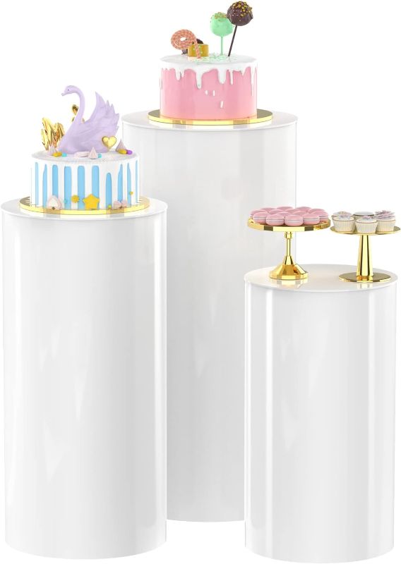 Photo 1 of Cylinder Pedestal Stands 3Pcs White Round Cylinder Pedestal Display Plinth Pillars for Wedding Party Decor 35.4''(L),29.5''(M),23.6''(S)