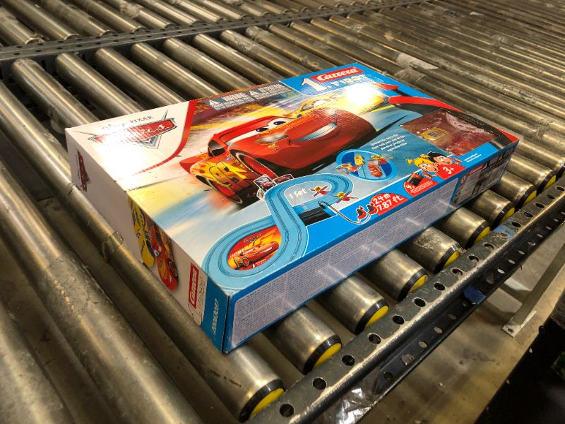 Photo 2 of Carrera First Disney/Pixar Cars - Slot Car Race Track - Includes 2 Cars: Lightning McQueen and Dinoco Cruz - Battery-Powered Beginner Racing Set for Kids Ages 3 Years and Up Disney Cars w/ Spinners