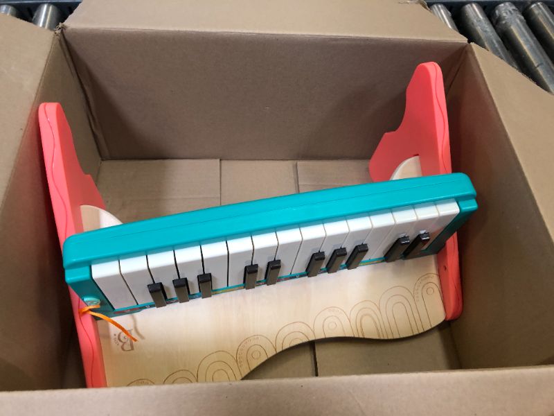 Photo 1 of B. toys wooden toy piano with songbook, piano wooden toy, music toy, musical instrument to learn to play the piano for children from 3 years old.