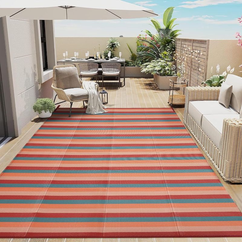 Photo 1 of Outdoor Waterproof Patio Rug 5x8 Plastic Straw Reversible Lightweight Outside Area Rug Orange Red Colorful Stripe Carpet Indoor Outdoor Washable Rug for Camping RV Porch Deck Balcony Beach
