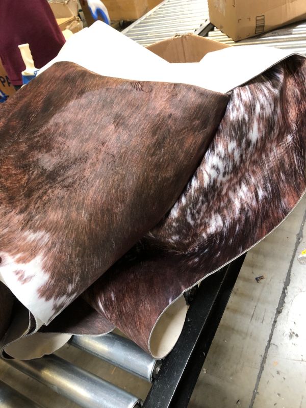 Photo 2 of AROGAN 8x10 Faux Cowhide Area Rugs for Living Room, Animal Skins Cow Hide Rug for Bedroom, Cool Western Christmas Decor, Thin Leather Cow Hide Carpets Fireplace Rug, Saddle Brown 114“×96” / 9.5×8 ft Saddle Brown