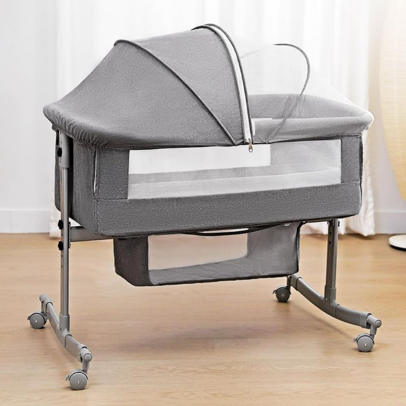 Photo 1 of Bedside Crib for Baby, 3 in 1 Bassinet with Large Curvature Cradle, Bedside Sleeper Adjustable and Movable Beside Bassinet with Mosquito Nets, Safety Certificattion Guarantee (Grey)