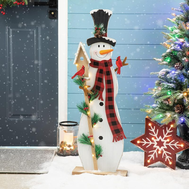 Photo 1 of Glitzhome 36" H Lighted Wooden Christmas Snowman Porch Sign Standing Snowman with Birdhouse Porch Decor Rustic Merry Christmas Welcome Sign Holiday Party Outdoor Indoor Xmas Decorations