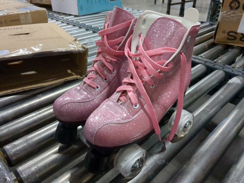 Photo 1 of PINK ROLLER SKATES, WOMEN'S SIZE 7