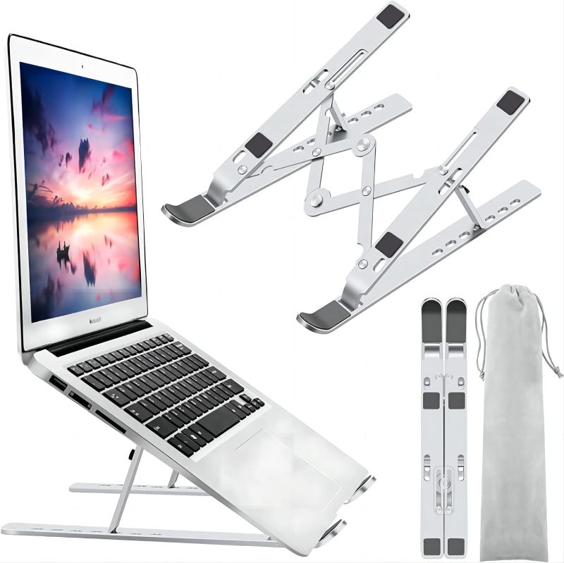 Photo 1 of Laptop Stand, Laptop Holder Riser Computer Stand, Adjustable Aluminum Foldable Portable Notebook Stand, Compatible with MacBook Air Pro, HP, Lenovo, Dell, More 10-15.6” Laptops and Tablets (Silver)
