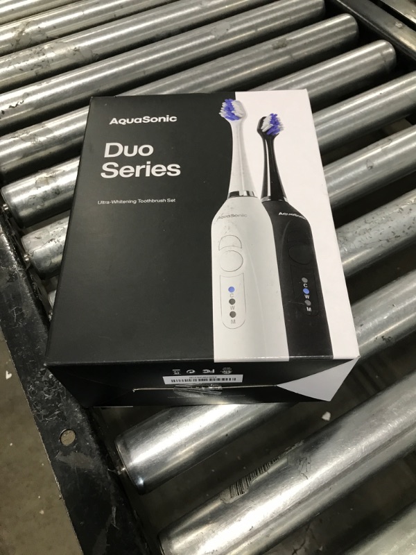 Photo 3 of Aquasonic Duo Dual Handle Ultra Whitening 40,000 VPM Wireless Charging Electric ToothBrushes - 3 Modes with Smart Timers - 10 Dupont Brush Heads & 2 Travel Cases Included