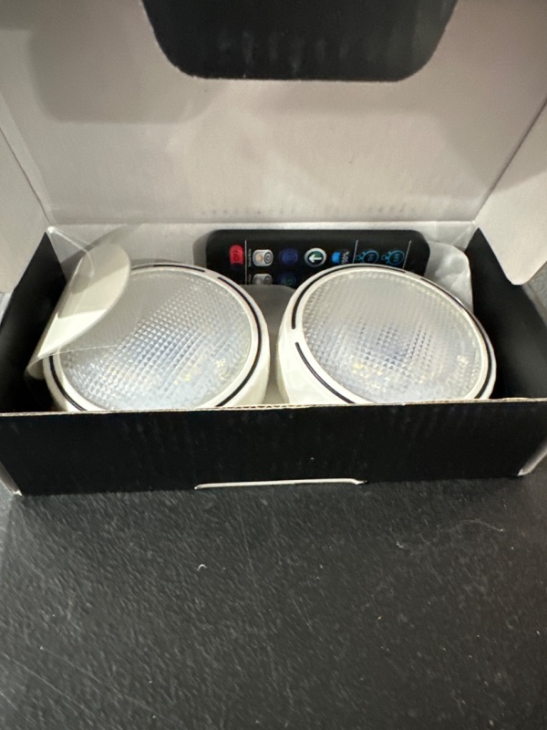 Photo 1 of Onumii LED Puck Lights Battery Operated Wireless Stick on LED Tap Lights 16 Color Changing Dimmable and Remote Control for Under Counter, Shelf, Bookcase, Cabinet (2 Pack White) White 2 Pack