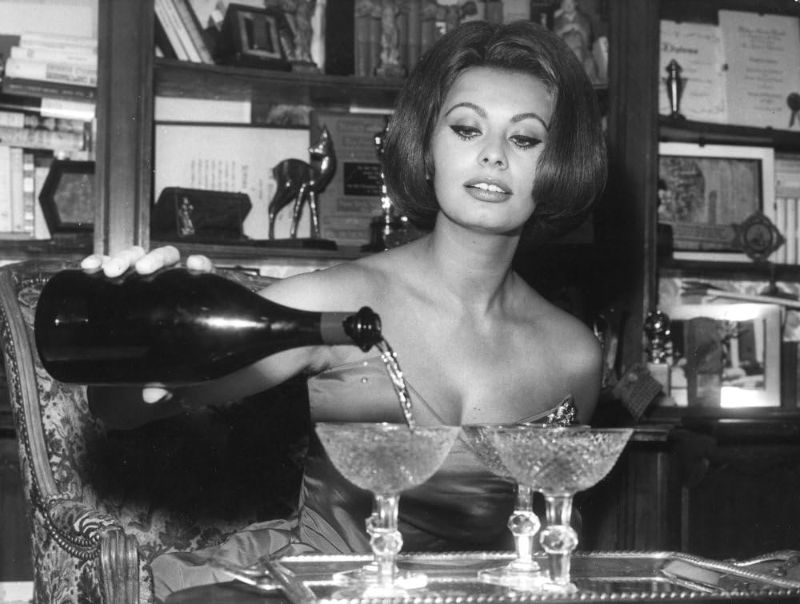 Photo 1 of Sophia Loren pouring wine Photo Print (30 x 24)
