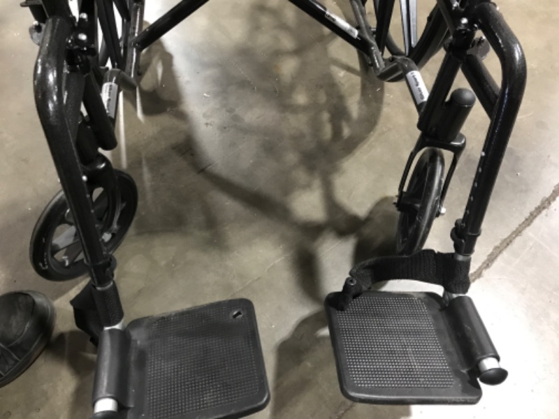 Photo 1 of Drive Medical SSP118FA-SF Silver Sport 1 Folding Transport Wheelchair with Full Arms and Removable Swing-Away Footrest, Black
