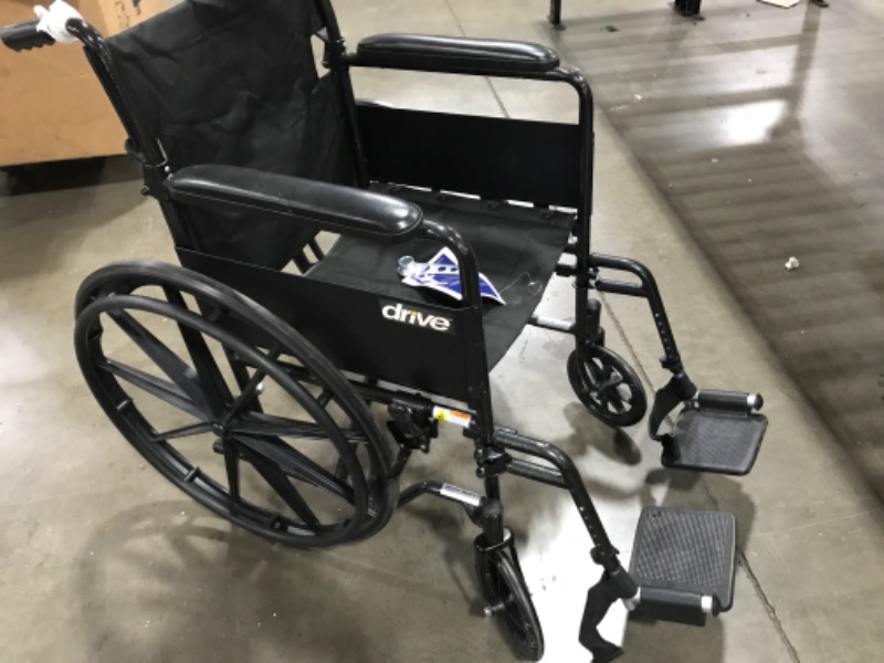 Photo 3 of Drive Medical SSP118FA-SF Silver Sport 1 Folding Transport Wheelchair with Full Arms and Removable Swing-Away Footrest, Black