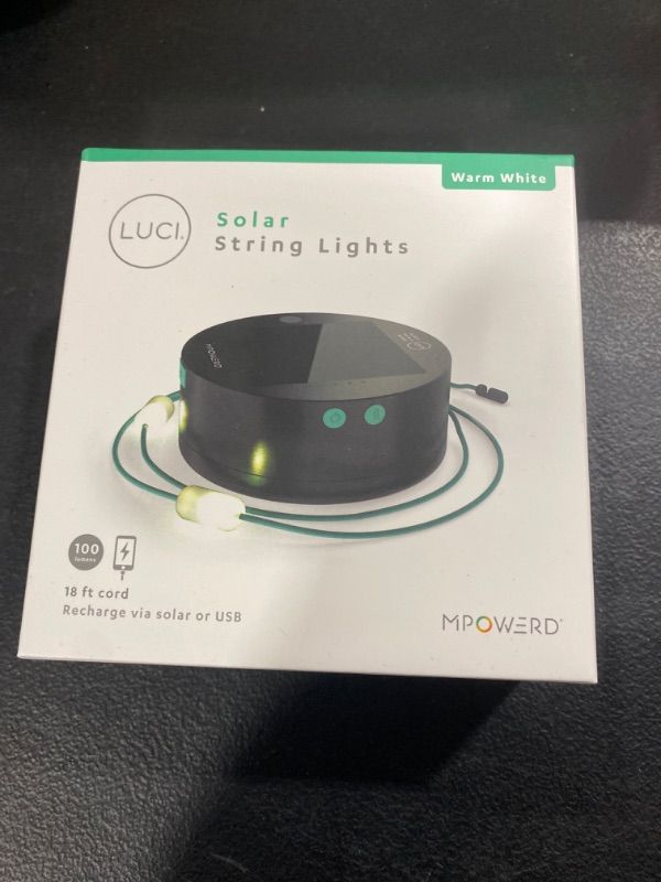 Photo 1 of MPOWERD Luci Solar String Lights + Phone Charger: White 18' Rechargeable via Solar or USB-A, 100 Lumens LEDs, Lasts Up to 20 Hours, Waterproof, Camping, Backyard, and Travel Dark grey, teal Luci String: 18' Warm White + USB-A Charging