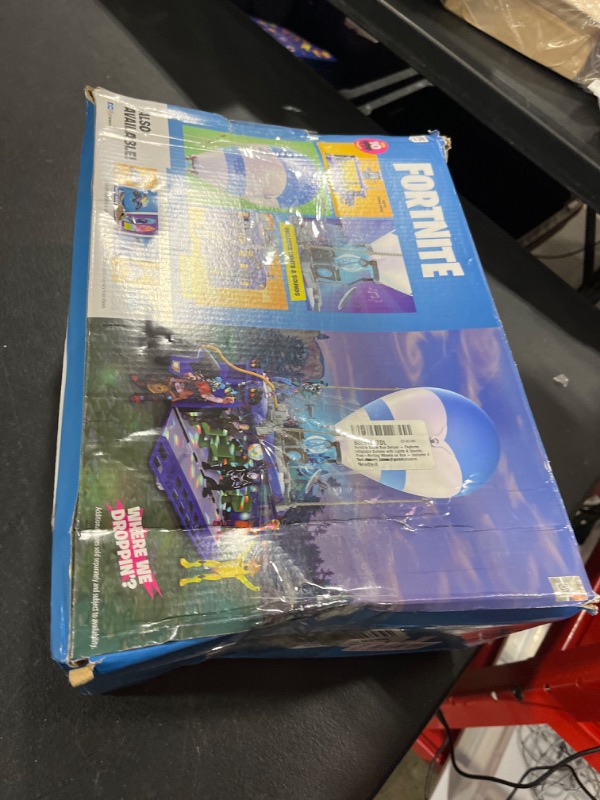 Photo 3 of Fortnite Battle Bus Deluxe - Features Inflatable Balloon with Lights & Sounds, Free-Rolling Wheels on Bus - Includes 4 Inch Recruit (Jonesy) and Exclusive Tomatohead Action Figures