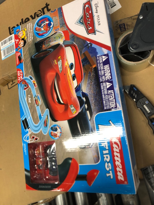 Photo 2 of Carrera First Disney/Pixar Cars - Slot Car Race Track - Includes 2 Cars: Lightning McQueen and Jackson Storm - Battery-Powered Beginner Racing Set for Kids Ages 3 Years and Up Disney Pixar Cars - Piston Cup