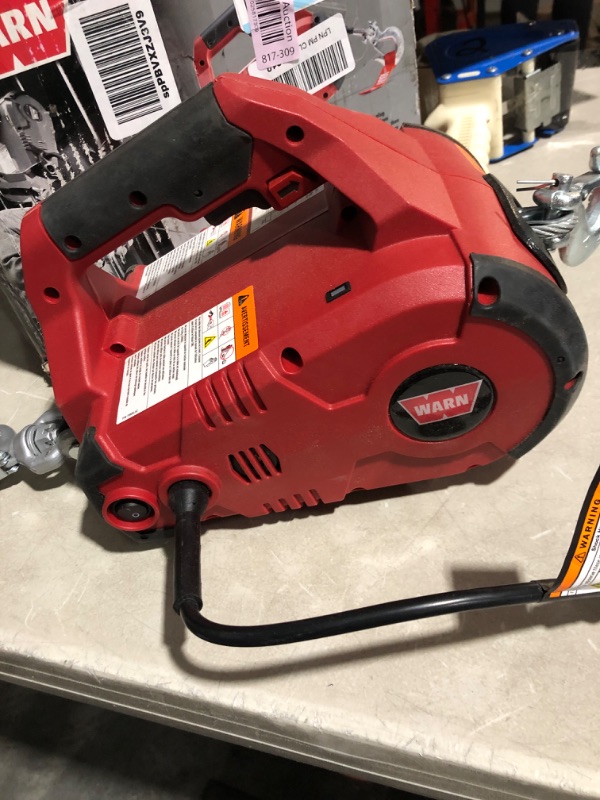 Photo 3 of * see clerk notes * 
WARN 885000 PullzAll Corded 120V AC Portable Electric Winch with Steel Cable: 1/2 Ton (1,000 Lb) Pulling Capacity , Red