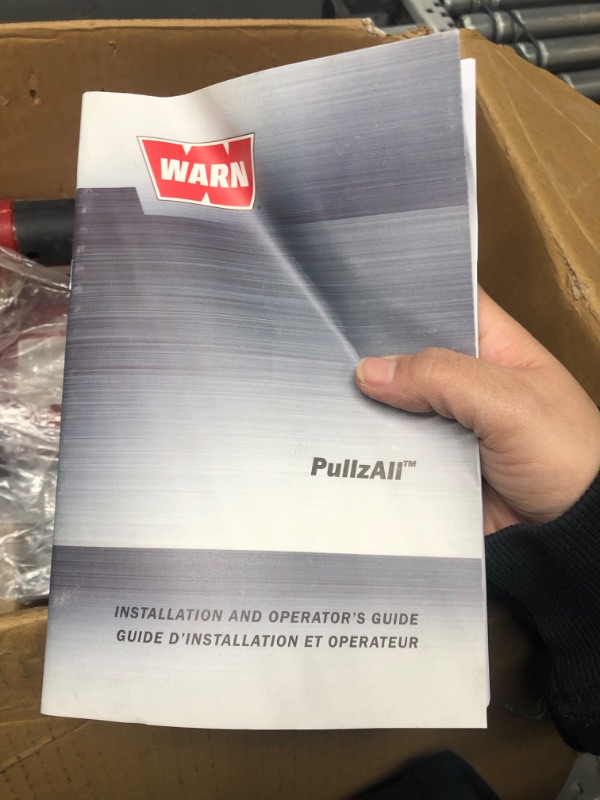 Photo 5 of * see clerk notes * 
WARN 885000 PullzAll Corded 120V AC Portable Electric Winch with Steel Cable: 1/2 Ton (1,000 Lb) Pulling Capacity , Red