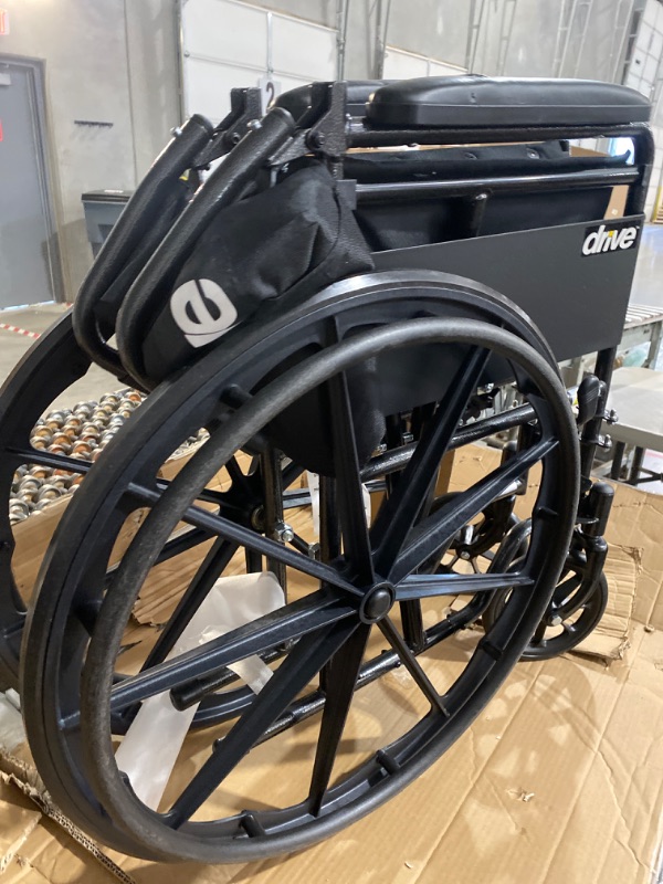 Photo 3 of **DAMAGED ARM REST**MISSING FOOT RESTS**
Drive Medical SSP118FA-SF Silver Sport 1 Folding Transport Wheelchair with Full Arms and Removable Swing-Away Footrest, Black