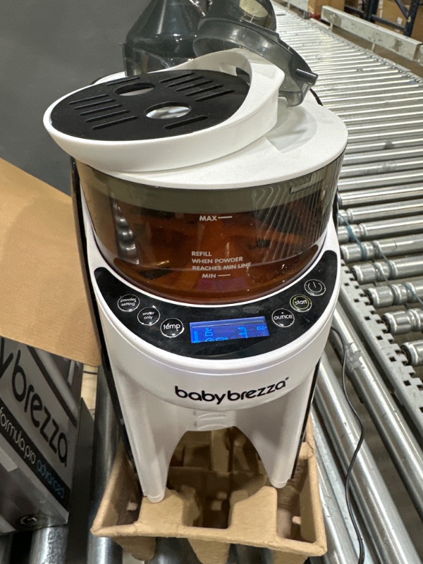 Photo 1 of Baby Brezza New and Improved Formula Pro Advanced Formula Dispenser Machine - Automatically Mix a Warm Formula Bottle Instantly - Easily Make Bottle with Automatic Powder Blending, White