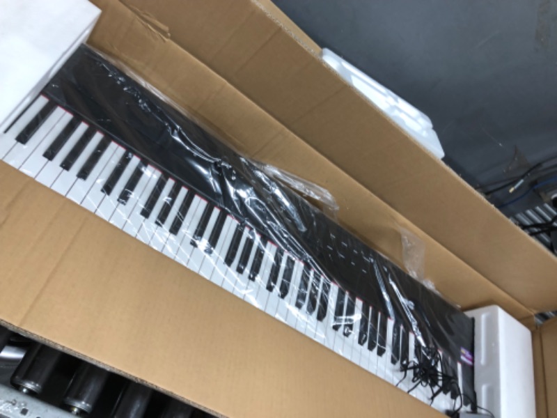 Photo 1 of ***USED - POWERS ON - UNABLE TO TEST FURTHER - SHEET MUSIC STAND BROKEN***
RockJam 88 Key Digital Piano with Full Size Semi-Weighted Keys, Power Supply, Sheet Music Stand