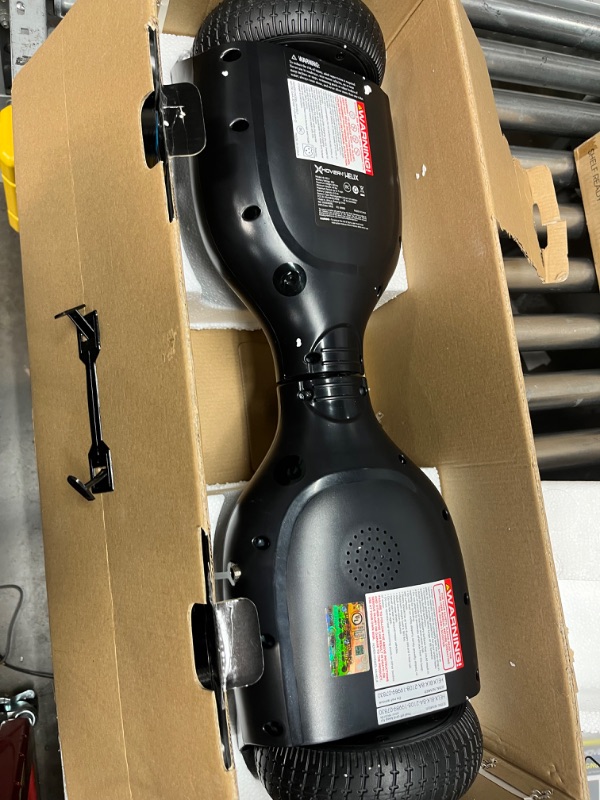 Photo 1 of Hover-1 Helix Electric Hoverboard | 7MPH Top Speed, 4 Mile Range, 6HR Full-Charge, Built-in Bluetooth Speaker, Rider Modes: Beginner to Expert Hoverboard Black