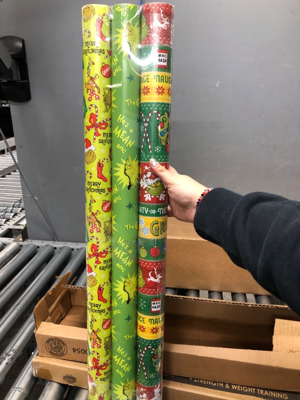 Photo 2 of American Greetings Christmas Wrapping Paper with Cut Lines Bundle, The Grinch (3 Rolls, 105 sq. ft.)