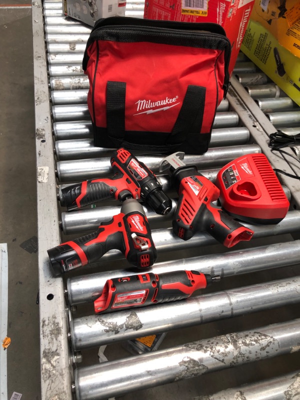 Photo 2 of ***USED - LIKELY MISSING PARTS - UNABLE TO VERIFY FUNCTIONALITY***
Milwaukee M12 12V Lithium-Ion Cordless 4-Tool Combo Kit with (2) Compact 1.5Ah Batteries and Charger