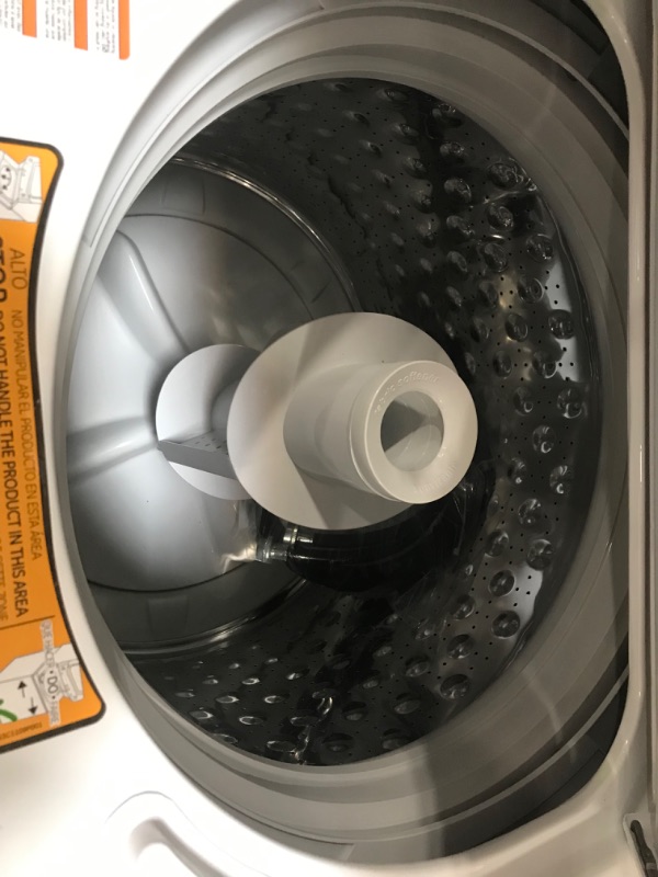 Photo 1 of GE Electric Stacked Laundry Center with 3.8-cu ft Washer and 5.9-cu ft Dryer

