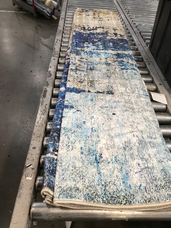 Photo 1 of 6ft by 7ft blue design carpet