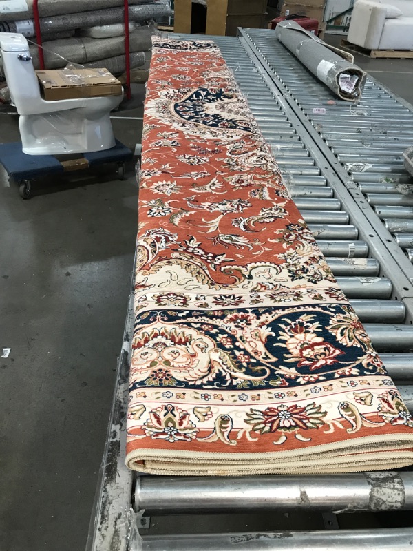 Photo 1 of 10ft by 8ft orange and cream design area carpet