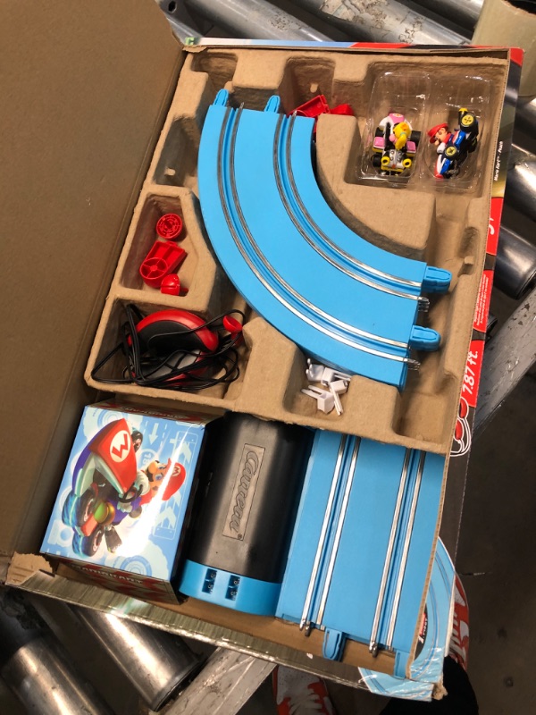 Photo 2 of Carrera First Mario Kart - Slot Car Race Track with Spinners - Includes 2 Cars: Mario and Peach - Battery-Powered Beginner Racing Set for Kids Ages 3 Years and Up Mario Kart w/ Peach