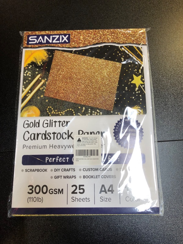 Photo 1 of 25 Sheets Gold Glitter Cardstock - 110lb. 300 GSM - 8.2 x 11.7 Inch Heavyweight Glitter Paper Cardstock for Cricut, Scrapbook, DIY Crafts, Decor, Gift Wraps, Booklet Covers, Custom Cards 8.27x11.7 Inches - 25 Sheets Gold