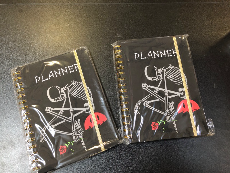 Photo 2 of  2 PACK BUNDLE 
2024 Planner, 12-Month Weekly Monthly Planner from JAN.2024 to DEC.2024, 8.4" X 6", Planner Notebook with Spiral Bound, Stickers & Sticky Index Tabs, Thinker Skull Black - 02