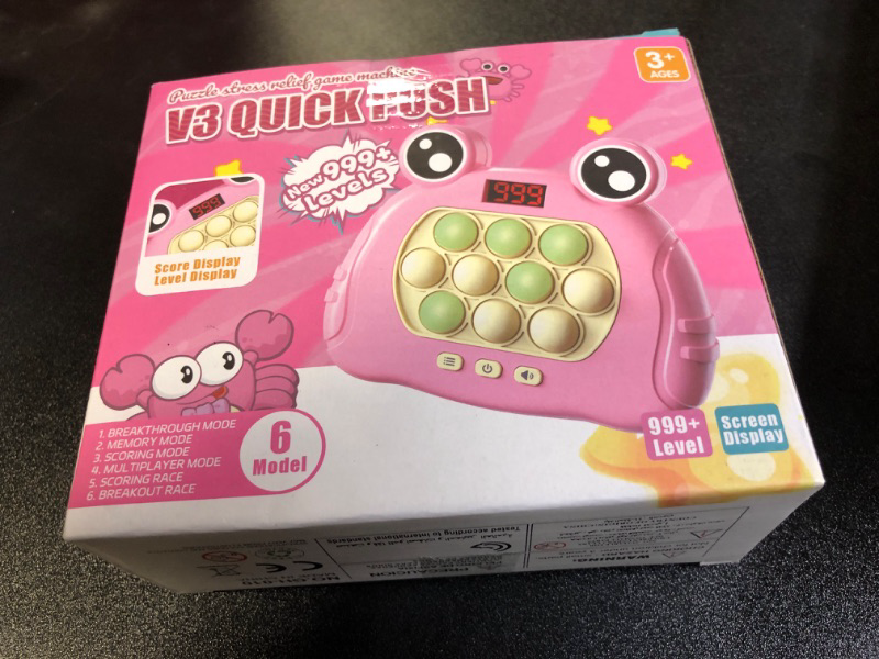 Photo 1 of LLESSOO Fast Push Game Fidget Toys Pop Game Handheld Bubble Game Console Light up Pop Game Sensory Fidget Toys for Kids Ages 3-12 for Boys and Girls, Birthday Gift (Frog-Pink)