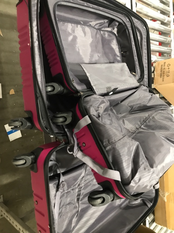 Photo 3 of Kenneth Cole Out Of Bounds Lightweight Durable Hardshell 4-Wheel Spinner Cabin Size Travel Suitcase, Magenta, 2-Piece Set (20" & 28") Magenta 2-Piece Set (20" & 28")