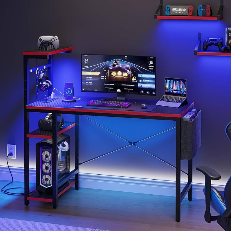 Photo 1 of Bestier Gaming Desk with Power Outlets, 44 Inch Led Gamer Desk with 4 Tiers Reversible Shelves ( 3D Carbon Fiber)