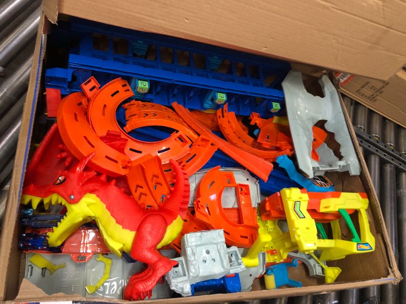 Photo 1 of Hot Wheels City Ultimate Garage Playset with 2 Die-Cast Cars, Toy Storage for 50+ 1:64 Scale Cars, 4 Levels of Track Play, Defeat The Dragon