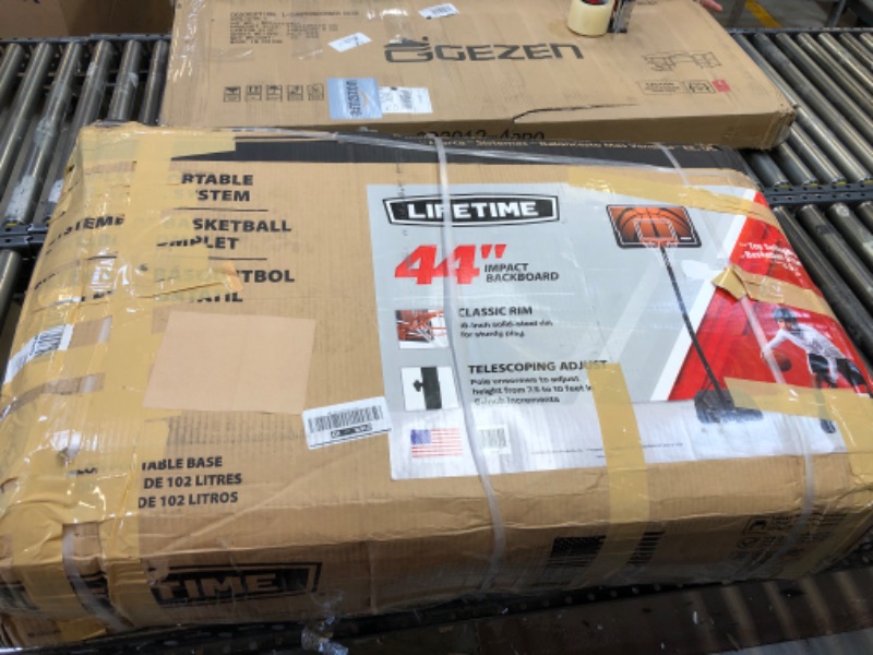 Photo 1 of Lifetime Height Adjustable Portable Basketball System, 44 Inch Backboard 44" Polyethylene Backboard Portable Black/Orange