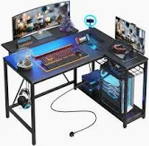 Photo 1 of *FOR PARTS* Bestier Small L Shaped Gaming Desk with Power Outlets,42 inch LED Computer Desk with Monitor Stand Reversible Storage Shelves Corner Gamer Desk with Headset Hooks USB Charging Port,Carbon Fiber Black