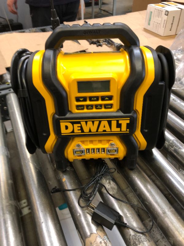 Photo 2 of DEWALT DXAEPS14 1600 Peak Battery Amp 12V Automotive Jump Starter/Power Station with 500 Watt AC Power Inverter, 120 PSI Digital Compressor, and USB Power , Yellow