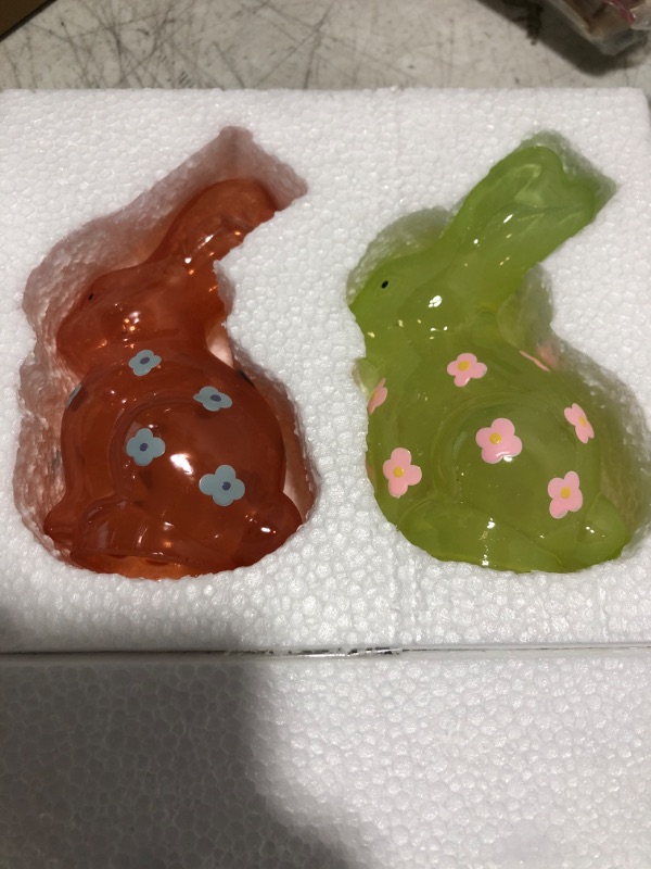 Photo 2 of Glass Bunny Figurines Set of 2, Green and Orange Crystal Bunny Statues, Easter Bunny Decor with Delightful Flower Accents, Cute Easter Rabbit Gift, Party Decorations Flower Accent Set of 2