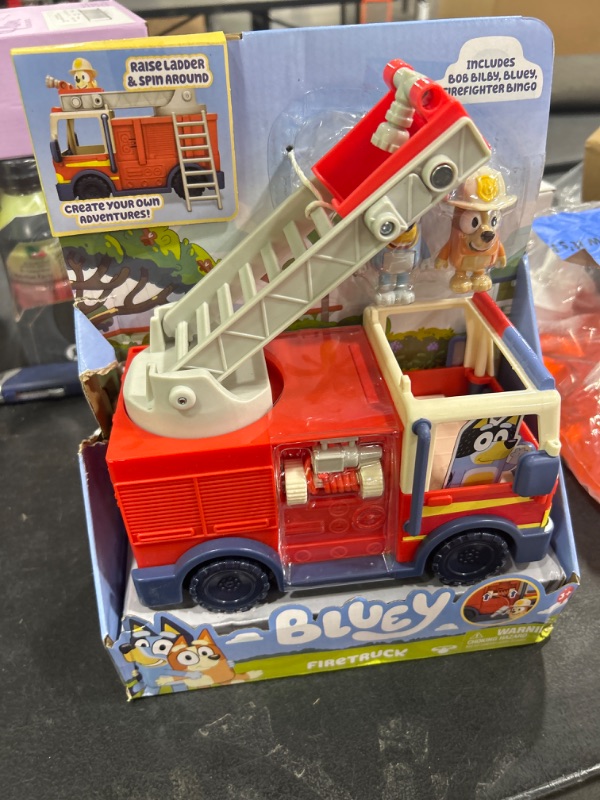 Photo 2 of BLUEY Firetruck | Firetruck, Exclusive Firefighter Bingo and Bob Bilby Figures | Raise The Ladder, Spin It Around and Roll Out The Hose | Includes Sticker Sheet