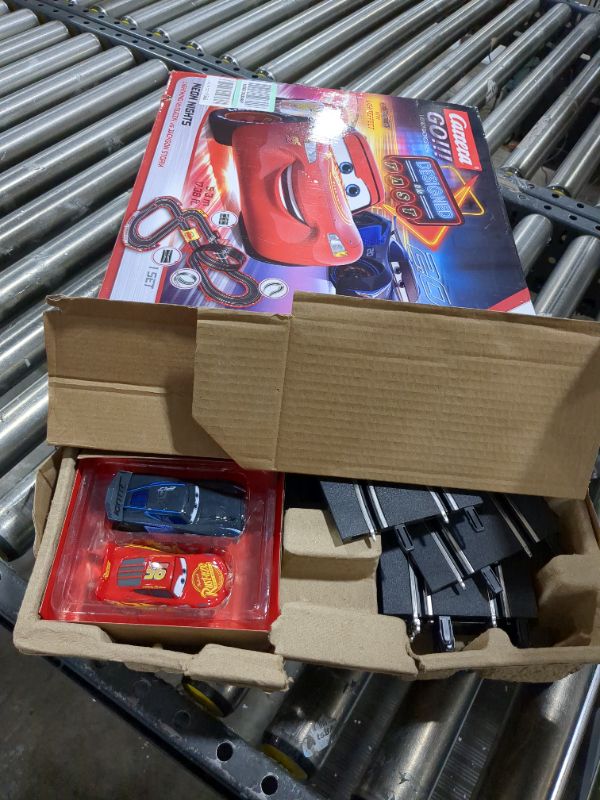 Photo 2 of Carrera GO!!! 62477 Disney Pixar Cars Neon Nights Electric Slot Car Racing Kids Toy Race Track Set Includes 2 Controllers and 2 Cars in 1:43 Scale Disney Cars Neon