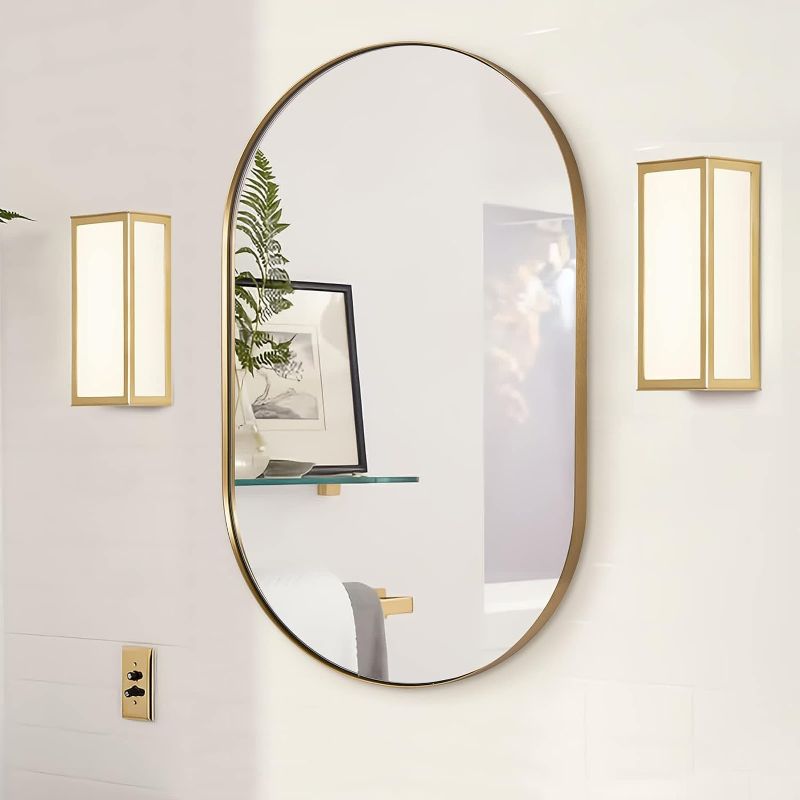 Photo 1 of ANDY STAR Gold Oval Mirror, Brass Mirror for Wall, Oval Mirrors for Bathroom in Stainless Steel Metal 1’’ Thin Frame Pill Shaped Mirror Hangs Vertical or...
