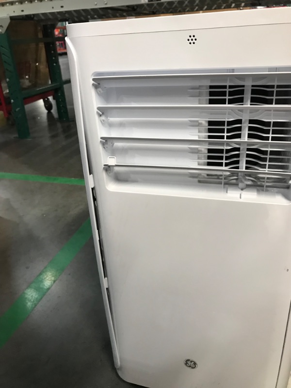 Photo 1 of **READ NOTES, MINOR DAMAGE**
GE Portable 3-in-1 Air Conditioner with Dehumidifier and Fan, 9,000 BTU, Cooling for 250 sq ft rooms, Includes Remote, Vent Hose and Easy Window Install Kit