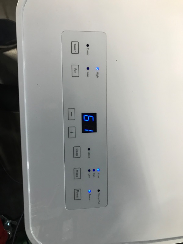 Photo 1 of **READ NOTES, MINOR DAMAGE**
GE Portable 3-in-1 Air Conditioner with Dehumidifier and Fan, 9,000 BTU, Cooling for 250 sq ft rooms, Includes Remote, Vent Hose and Easy Window Install Kit